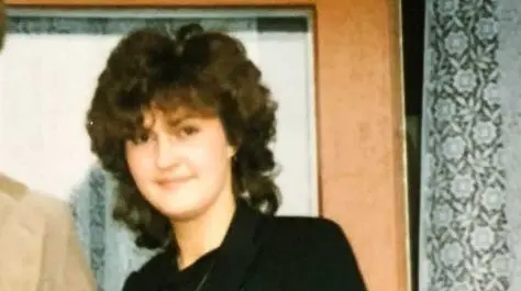 Sabine Löhmann, 1990 mit Dauerwelle und schwarzem Blazer.