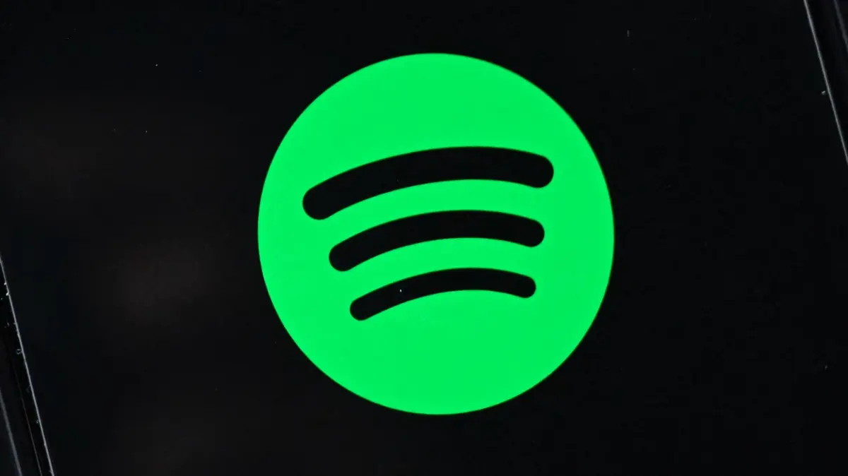 (FILES) The company logo of Swedish music streaming giant spotify is pictured on a smartphone in Berlin on January 23, 2023. Music streaming giant Spotify has been sued in a US federal court for allegedly underpaying songwriters, composers and publishers by tens of millions of dollars. The lawsuit against Spotify USA was filed in New York on May 16, 2024 by the Mechanical Licensing Collective (MLC), a non-profit that collects and distributes royalties owed from music streaming services. (Photo by Tobias Schwarz / AFP)