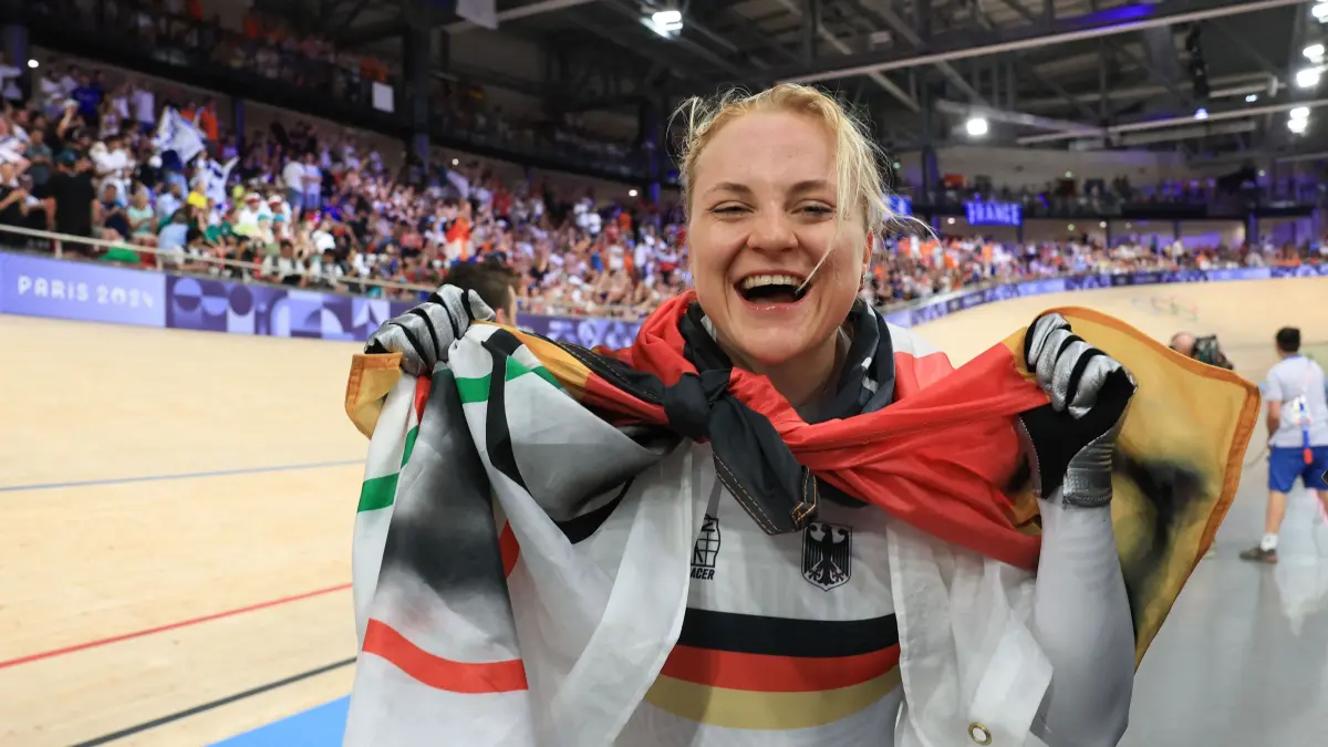 Germany's Lea Sophie Friedrich celebrates taking second place silver medal afer the women's track cycling sprint final race 2 for gold of the Paris 2024 Olympic Games at the Saint-Quentin-en-Yvelines National Velodrome in Montigny-le-Bretonneux, south-west of Paris, on August 11, 2024. (Photo by Emmanuel DUNAND / AFP)
