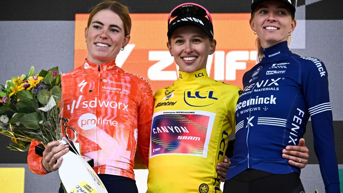 Cycling: World Tour , Tour de France Femmes 2024: (From L) Stage winner and second placed Team SD Worx - Protime's Dutch rider Demi Vollering, Overalll leader and first placed Canyon//SRAM Racing team's Polish rider Katarzyna Niewiadoma wearing the overall leader's yellow jersey and third placed Fenix-Deceuninck team's Dutch rider Pauliena Rooijakkers celebrate on the podium after competing in the 8th and last stage of the third edition of the Women's Tour de France cycling race, a 149.9 km between Le Grand Bornand and the Alpe d'Huez, in L'Alpe d'Huez, south-eastern France, on August 18, 2024. (Photo by JULIEN DE ROSA / AFP)