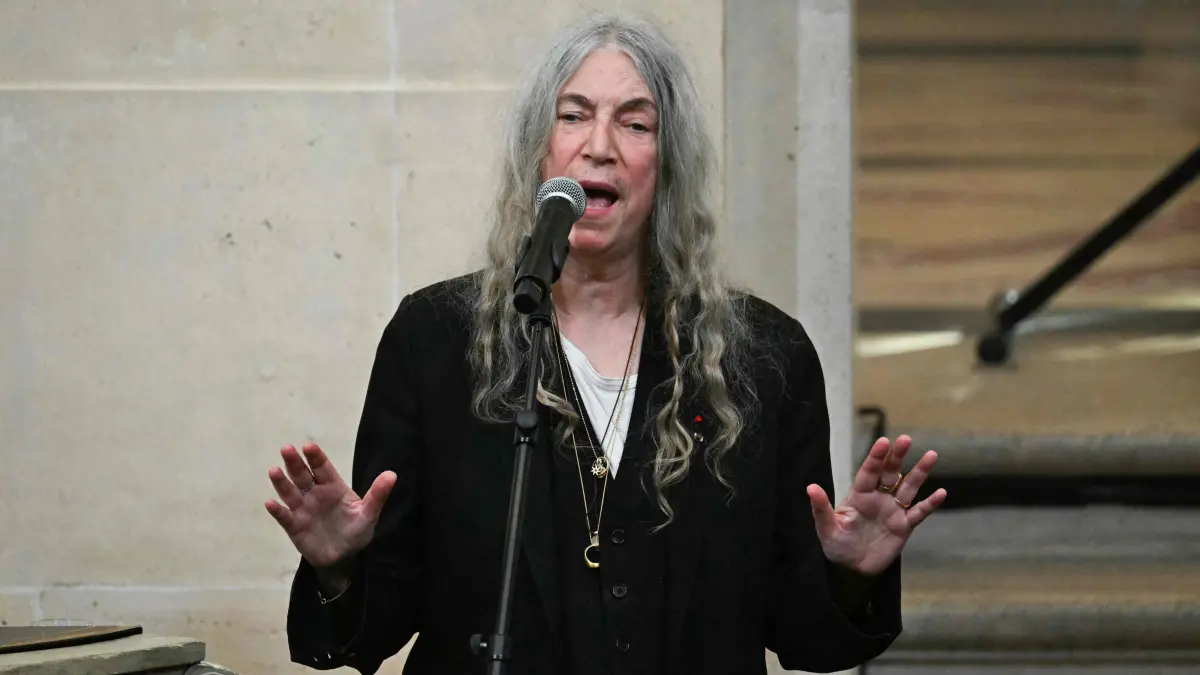 (FILES) US rock singer, songwriter, musician, and poet Patti Smith performs during the induction ceremony of the US photographer Annie Leibovitz (unseen) as a foreign associate member of the French Academy of Fine Arts at the Institut de France in Paris, on March 20, 2024. U.S. poet and musician Patti Smith canceled a show scheduled for January 30, 2025, in Sao Paulo after suffering a ?severe headache? and ?dizziness? that forced her to cancel a performance the day after in the Brazilian city. (Photo by MIGUEL MEDINA / AFP)