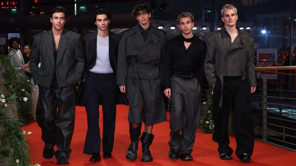 776282771: German music group 'Elevator Boys' pose for photographers as they arrive on the red carpet for the opening ceremony and the screening of the film ?Das Licht? (The light) in the "Berlinale special" section of the 75th Berlinale, Europe's first major film festival of the year, in Berlin on February 13, 2025. (Photo by Ronny HARTMANN / AFP)