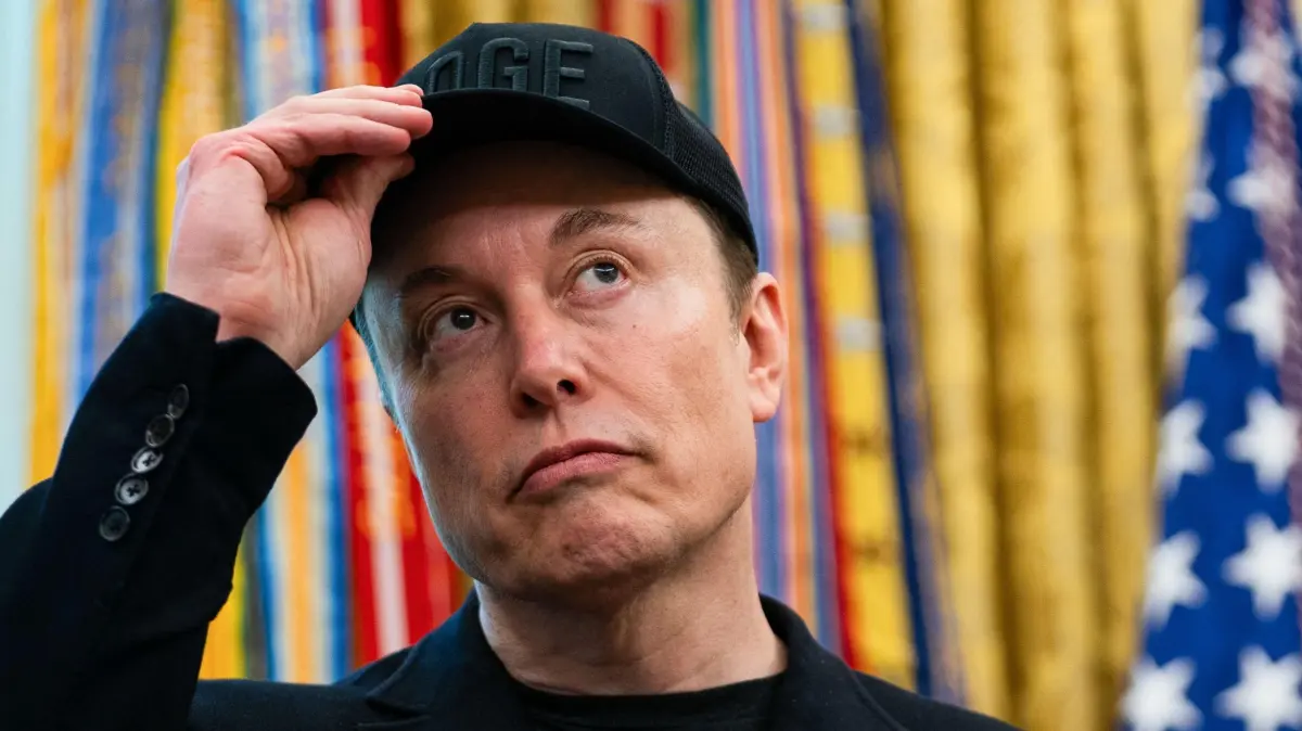 (FILES) Elon Musk looks on during a news conference with US President Donald Trump in the Oval Office of the White House in Washington, DC, on May 30, 2025. Tech billionaire Elon Musk on June 3, 2025, hammered the sprawling tax cuts and spending mega-bill that President Trump is trying to muscle through Congress as a "disgusting abomination." "The president already knows where Elon Musk stood on this bill, it doesn't change his opinion. This is one big, beautiful bill, and he's sticking to it," White House Press Secretary Karoline Leavitt told reporters on June 3. (Photo by Allison ROBBERT / AFP)