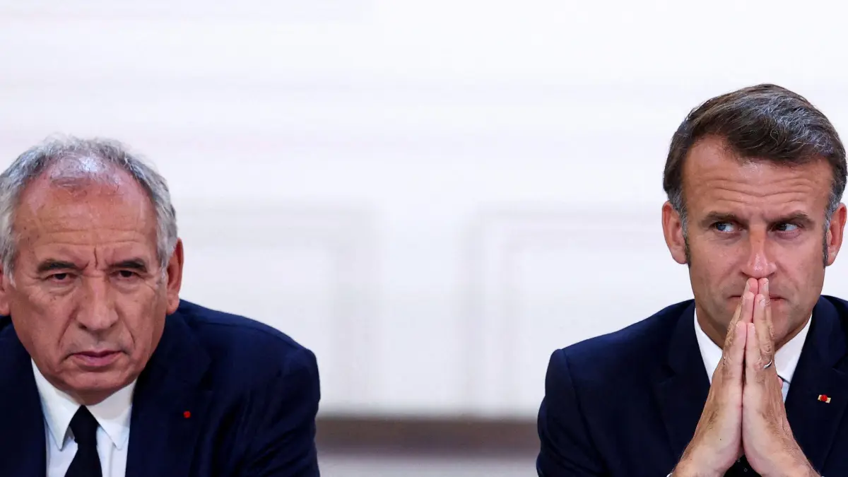 (FILES) Prime Minister Francois Bayrou (L) and French President Emmanuel Macron attend a meeting with New Caledonia's elected officials and state representatives at the Elysee Palace, in Paris on July 12, 2025. Analysts expect Bayrou and his government to fall on September 8, 2025 after just over half a year in office, with both the far right and left-wing parties vowing to vote against his minority administration. President Emmanuel Macron will then need to decide if he reappoints Bayrou, chooses a new premier who would be the seventh government chief of his presidency, or calls snap legislative elections. (Photo by Tom Nicholson / POOL / AFP)