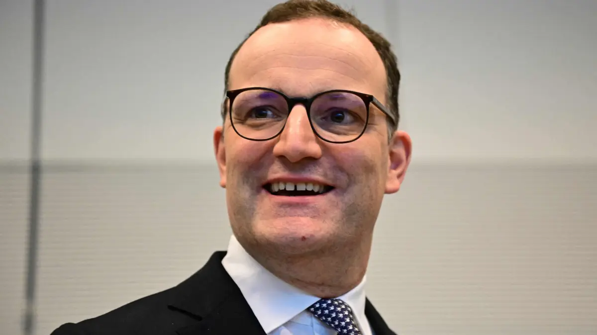 Parliamentary group leader of Germany's Christian Democratic Union (CDU) Jens Spahn is pictured after he delivered a press statement on the occasion of German Chancellor's 70th birthday, on November 11, 2025 at the start of a meeting with conservative Christian Democratic Union (CDU) party's parliamentary group in Berlin. (Photo by Tobias SCHWARZ / AFP)