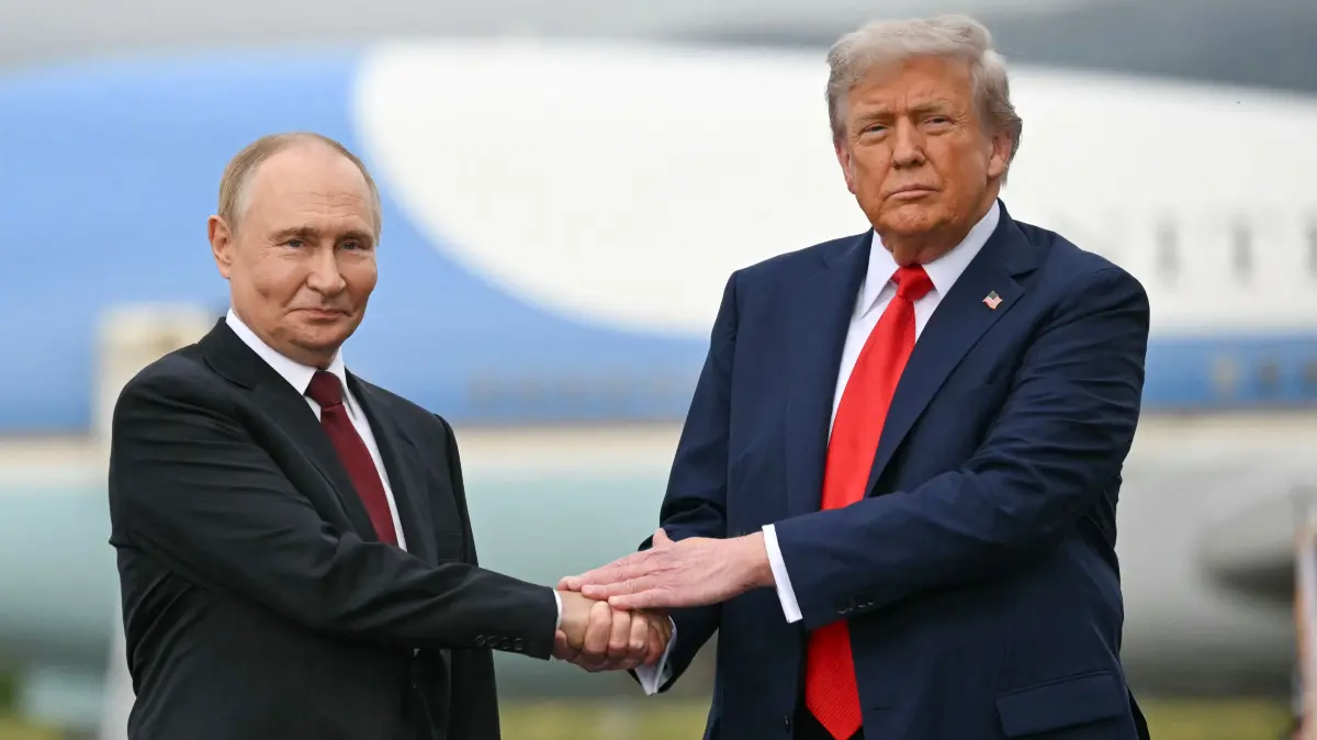 (FILES) US President Donald Trump greets Russian President Vladimir Putin on the tarmac after they arrived at Joint Base Elmendorf-Richardson in Anchorage, Alaska, on August 15, 2025. (Photo by ANDREW CABALLERO-REYNOLDS / AFP)