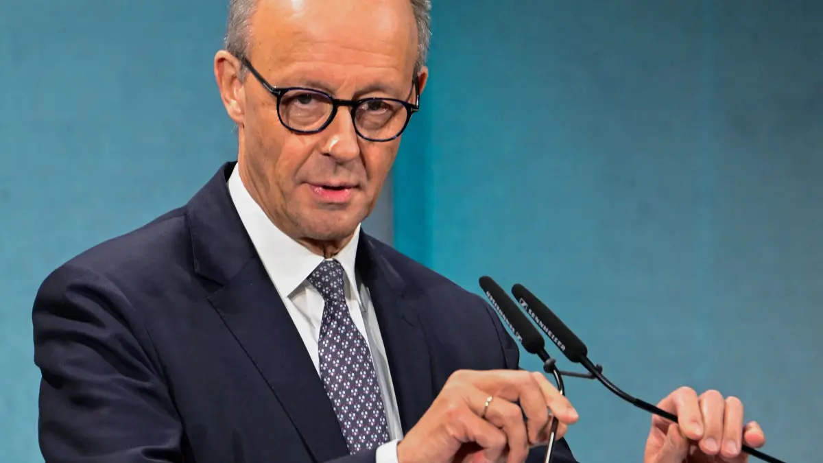 German Chancellor Friedrich Merz delivers the opening speech at an economic summit hosted by German newspaper Süddeutsche Zeitung at the Adlon Hotel in Berlin on November 17, 2025. (Photo by Tobias SCHWARZ / AFP)
