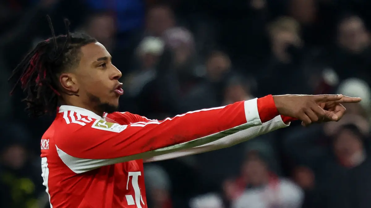 Bayern Munich's French midfielder #17 Michael Olise celebrates scoring his team's sixth goal during the German first division Bundesliga football match between FC Bayern Munich and SC Freiburg in Munich, southern Germany on November 22, 2025. Bayern Munich won the match 6-2. (Photo by Karl-Josef HILDENBRAND / AFP) / DFL REGULATIONS PROHIBIT ANY USE OF PHOTOGRAPHS AS IMAGE SEQUENCES AND/OR QUASI-VIDEO