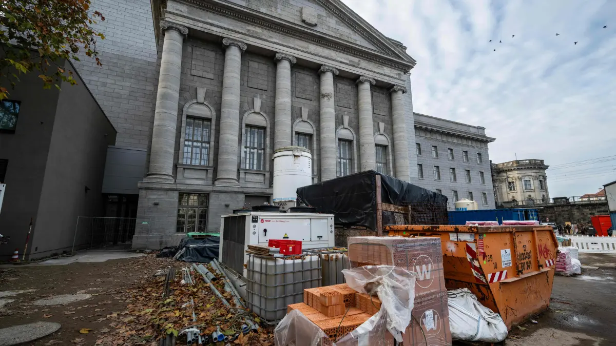 Building material is stored in front of the museum's north facade as renovation work continues at the Pergamon Museum, in Berlin on December 4, 2025. With the first construction phase completed, the Collection of Classical Antiquities, Museum of Islamic Art, and Museum of the Ancient Near East are expected to reopen to the public in spring 2027. The Pergamon Museum's complete renovation is expected to be finished in 2037. (Photo by John MACDOUGALL / AFP)