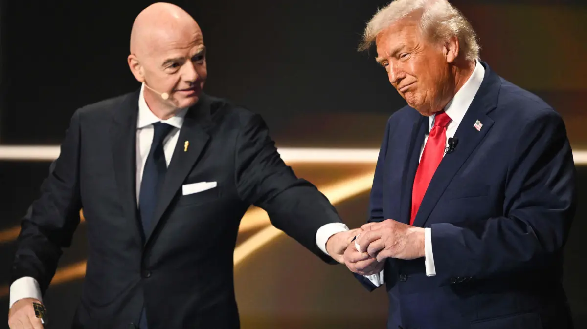 (L/R) FIFA President Gianni Infantino and US President Donald Trump participate in the draw for the 2026 FIFA Football World Cup taking place in the US, Canada and Mexico, at the Kennedy Center, in Washington, DC, on December 5, 2025. (Photo by Mandel NGAN / POOL / AFP)
