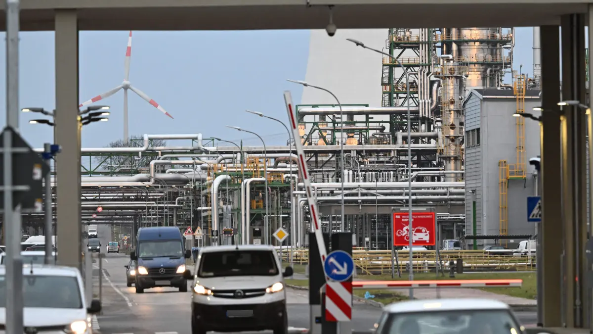 Picture taken on December 11, 2025 shows the PCK refinery, which supplies oil to Berlin and the surrounding region, in Schwedt, northeastern Germany. A damage at a pipeline of the major PCK refinery resulted in a "large oil spill", a spokesman for Brandenburg's environment ministry said. The PCK refinery near the border with Poland is majority-owned by Rosneft Deutschland, a local subsidiary of the Russian oil giant, and managed through a trusteeship by the German government. While no one was seriously injured as a result of the spill, an environment ministry spokesperson said the crude may have entered local rivers. (Photo by RALF HIRSCHBERGER / AFP)