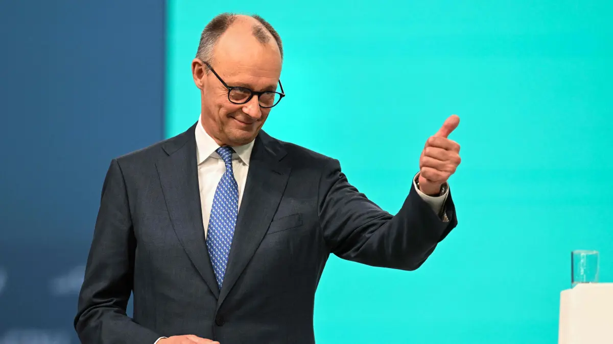 German Chancellor and CDU leader Friedrich Merz gives the thumbs-up after his speech during the party congress of Germany's Christian Democratic Union (CDU) in Stuttgart, southern Germany, on February 20, 2026. (Photo by THOMAS KIENZLE / AFP)