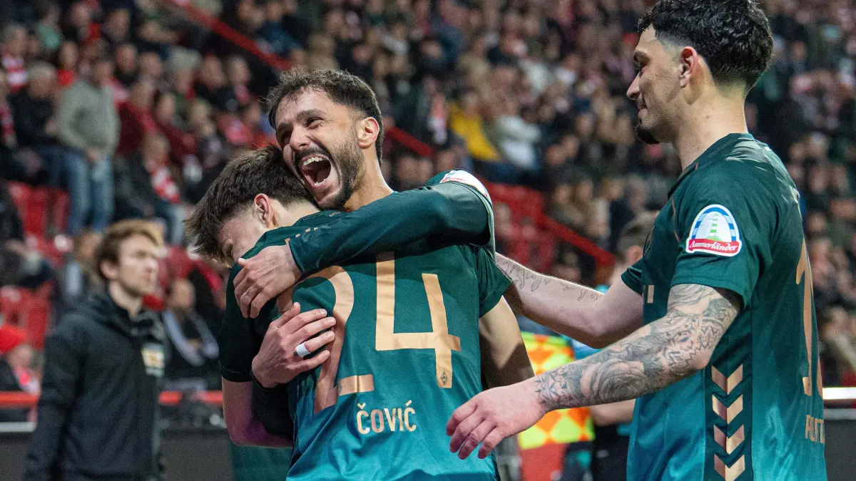 1. BL 1. FC Union - Werder Bremen 2025/26: Fußball, Herren, Saison 2025/2026, 1. Bundesliga (25. Spieltag), 1. FC Union Berlin - SV Werder Bremen, v.l. Patrice Covic (Bremen), Leonardo Bittencourt (Bremen), Cameron Puertas (Bremen), Jubel nach Tor zum 1:4, 08.03.2026, Foto: Sebastian Räppold / Matthias Koch