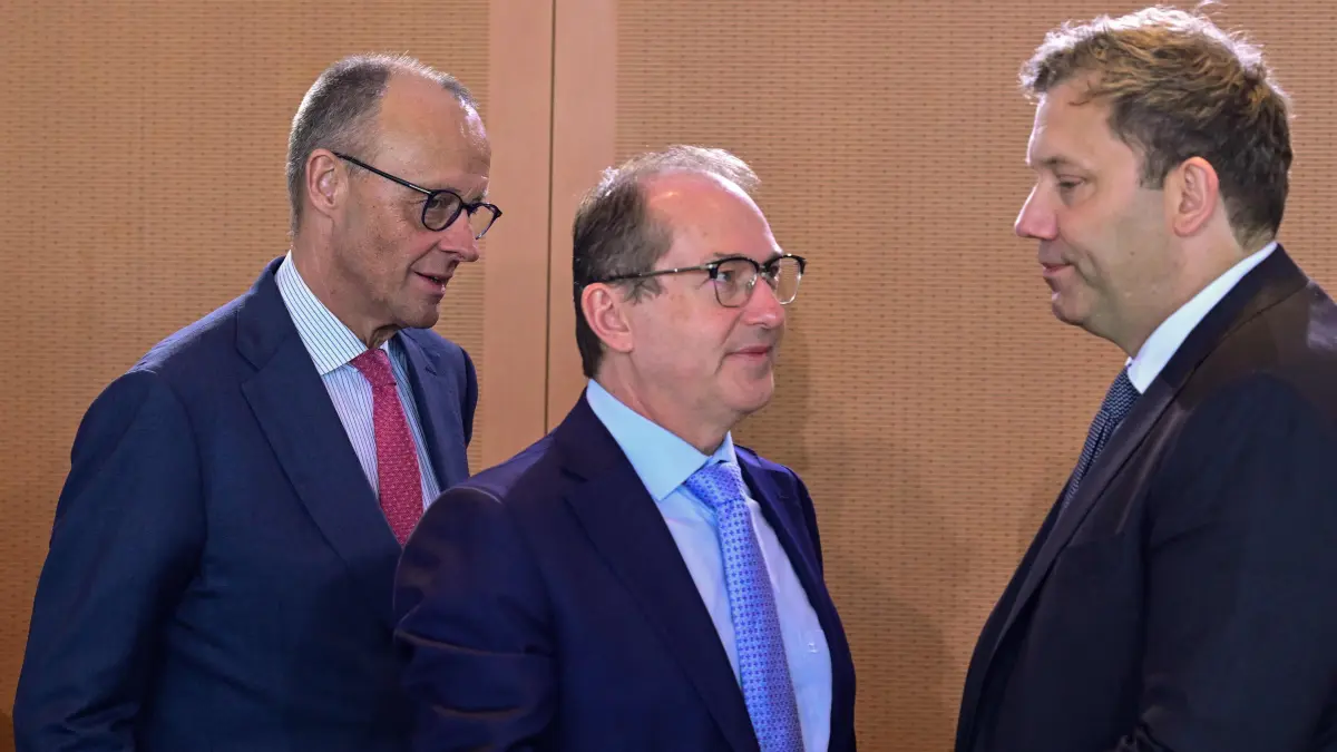 (L-R) Germany's Chancellor Friedrich Merz, Germany's Interior Minister Alexander Dobrindt and German Finance Minister and Vice Chancellor Lars Klingbeil talk prior the start of the weekly cabinet meeting at the Chancellery in Berlin on April 29, 2026. (Photo by John MACDOUGALL / AFP)