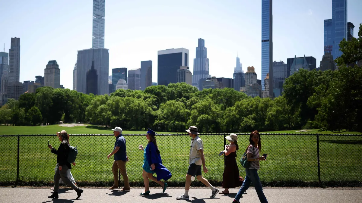Daily life in New York: People walk in Central Park in the Manhattan borough of New York City on May 20, 2026. (Photo by CHARLY TRIBALLEAU / AFP)