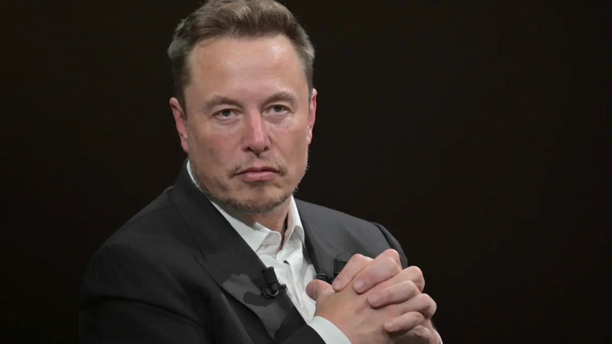 (FILES) SpaceX, Twitter and electric car maker Tesla CEO Elon Musk looks on as he speaks during his visit at the Vivatech technology startups and innovation fair at the Porte de Versailles exhibition center in Paris, on June 16, 2023. Elon Musk's SpaceX began its first day as a public company on Wall Street on June 12, 2026, after the biggest initial public offering in history, with the polarizing entrepreneur promising he will take humanity to Mars. The blockbuster operation, which raised more than $75 billion, is expected to make Musk the world's first trillionaire and kick off a series of major IPOs by AI companies in the coming months. (Photo by Alain JOCARD / AFP)