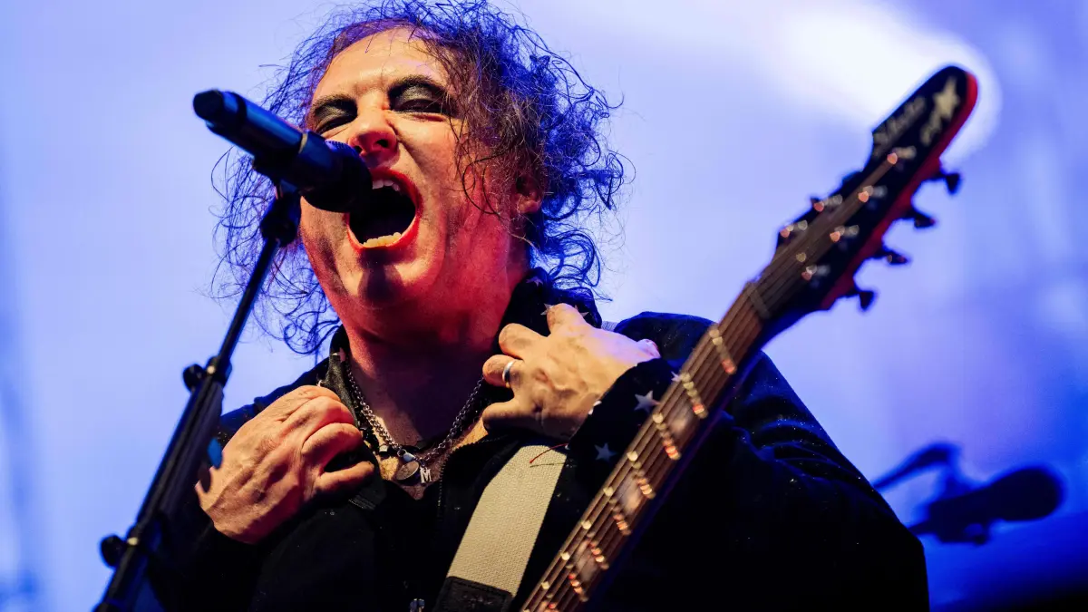 DENMARK-MUSIC-FESTIVAL: Britain's rock band The Cure performs on the Orange Stage during the Roskilde Festival on July 1, 2026. (Photo by Ida Marie Odgaard / Ritzau Scanpix / AFP) / Denmark OUT