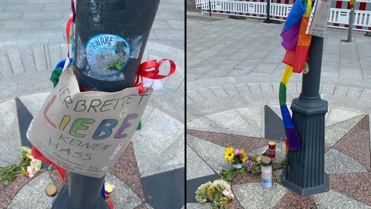 Mit Blumen, Regenbogenfahnen und dem Appell "Verbreitet Liebe" wird am Platz am Stern in Fürstenwalde der Opfer des Anschlags auf den Christopher Street Day in Berlin gedacht.