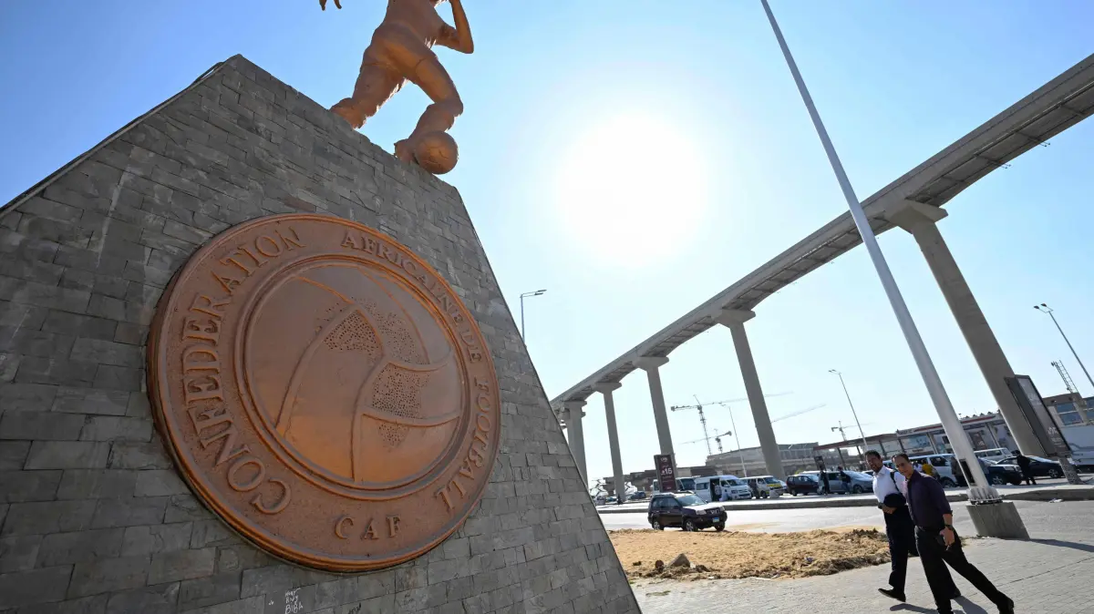 FB-WC-BUSINESS-FIFA-UEFA-CAF-MEETING: A sculpture is seen on the street where the headquarters of the Confederation of African Football (CAF) is located in 6th of October City in Giza governorate on August 6, 2026, ahead of CAF's virtual executive committee meeting. (Photo by Khaled DESOUKI / AFP)