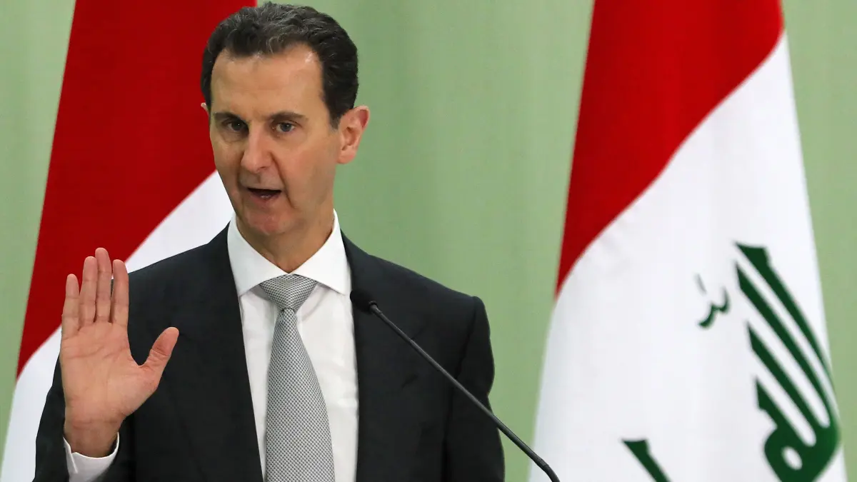 FILES-SYRIA-POLITICS-JUSTICE-ASSAD: (FILES) Syria's President Bashar al-Assad speaks during a press conference with Iraq's Prime Minister in Damascus on July 16, 2023. A Syrian court sentenced former ruler Bashar al-Assad in absentia to death on August 11, 2026, accusing him of "war crimes" and "crimes against humanity" after the outbreak of the country's civil war in 2011. The ruling is the first under the transitional authorities who this year began trying figures from the former government, both in person and in absentia. (Photo by LOUAI BESHARA / AFP)