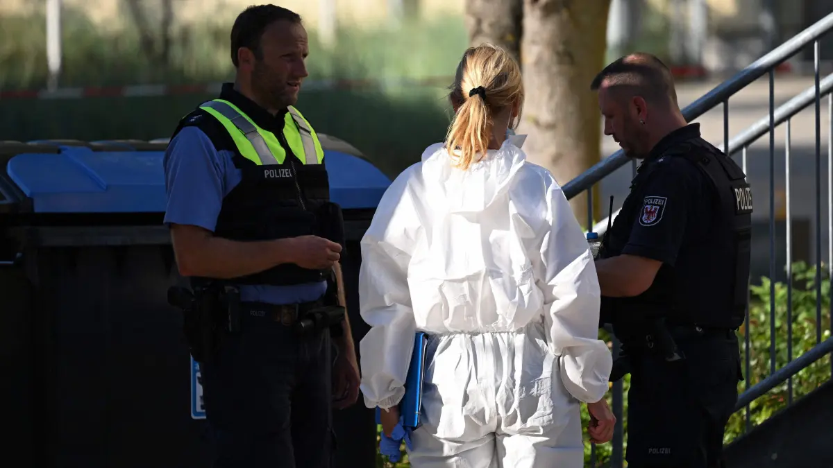GERMANY-CRIME-SCHOOL: Forensic police are seen on the grounds of the private Docemus school in Gosen-Neu Zittau, south-east of Berlin, on August 27, 2026, where two people were killed in a "violent incident". Local media reported August 27 that an 18-year-old female student and a 30-year-old man had died. Regional public broadcaster RBB and a local daily said that an alarm had been triggered at a secondary school in the town of Gosen-Neu Zittau, with police confirming they were on the scene and that a suspect had been arrested. (Photo by RALF HIRSCHBERGER / AFP)