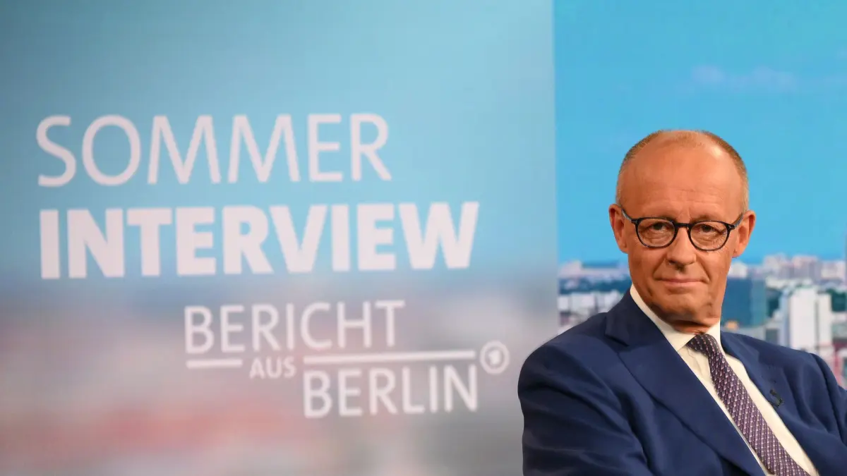 Photo opp before the recording of the summer interview with Chancellor Friedrich Merz by German public broadcaster ARD: German Chancellor Friedrich Merz takes his seat at the TV studio prior to his annual summer interview with public broadcaster ARD in Berlin on August 30, 2026. (Photo by RALF HIRSCHBERGER / AFP)