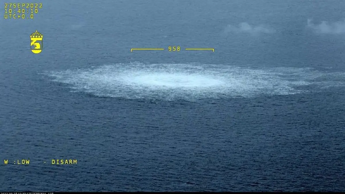 FILES-GERMANY-COURT-NORDSTREAM-SABOTAGE-SWEDEN-DENMARK-RUSSIA-UK: (FILES) This file handout photo released on September 27, 2022 and taken from an aircraft of the Swedish Coast Guard (Kustbevakningen) shows the release of gas emanating from a leak on the Nord Stream 1 gas pipeline, with the leak measuring over 950 meters in diameter, in the Swedish economic zone in the Baltic Sea, near the Danish island of Bornholm. A German court will next month put a Ukrainian man on trial over the 2022 bombing of the Nord Stream seafloor gas pipelines linking Russia with Europe, the tribunal said on September 3, 2026. Serhii Kuznietsov will face the Hamburg Higher Regional Court from October 14 in a trial expected to last until February. The Baltic Sea sabotage attack came months after Russia's February 2022 full-scale invasion of Ukraine and destroyed three of four pipelines of the major energy link. (Photo by Handout / SWEDISH COAST GUARD / AFP) / RESTRICTED TO EDITORIAL USE - MANDATORY CREDIT "AFP PHOTO / SWEDISH COAST GUARD" - NO MARKETING - NO ADVERTISING CAMPAIGNS - DISTRIBUTED AS A SERVICE TO CLIENTS