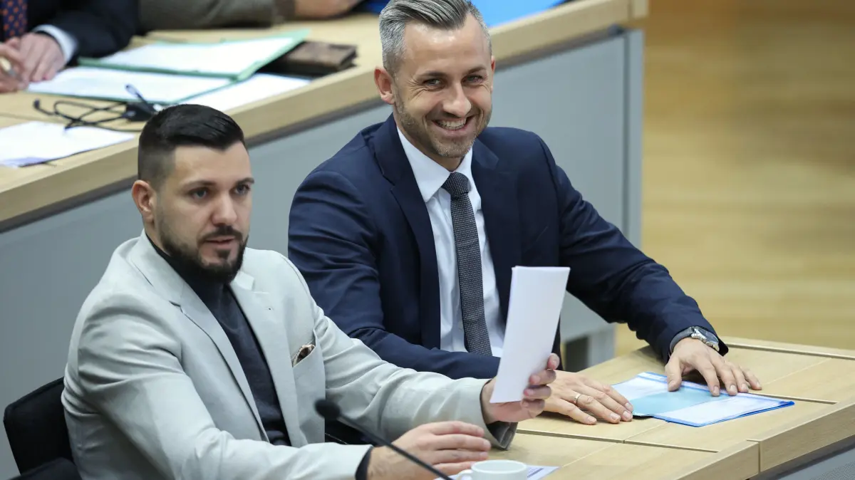 FILES-GERMANY-POLITICS-SAXONY-ANHALT: (FILES) Saxony-Anhalt's far-right Alternative for Germany (AfD) top candidate Ulrich Siegmund (R) and AfD member Tobias Rausch sit in Saxony-Anhalt's State Parliament, on January 28, 2026 in Magdeburg, eastern Germany, prior to the election of Saxony-Anhalt's new regional leader. According to media reports from September 29, 2026, Rausch was named candidate from his party's parliamentary group to become the president of Saxony-Anhalt's new parliament. The constitutive meeting of the parliament will take place on October 6, 2026, following regional state elections on September 6, 2026, in which the AfD won a landslide victory. (Photo by Ronny HARTMANN / AFP)
