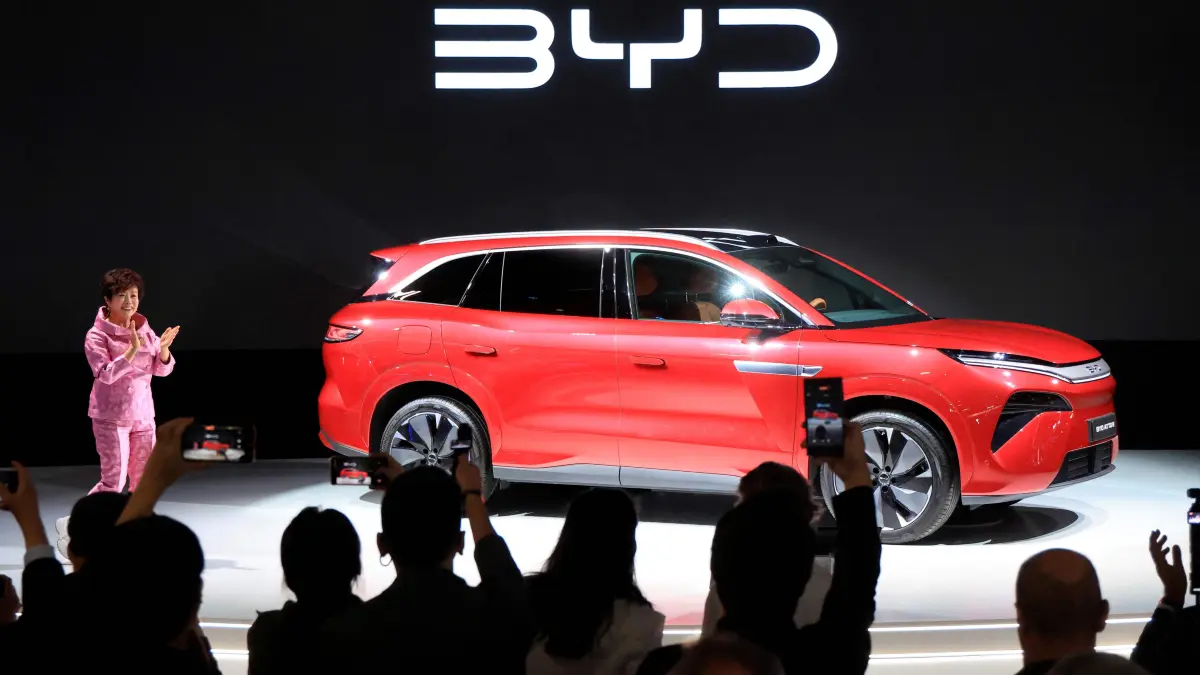 FRANCE-AUTO-SHOW-FAIR: Stella Li, Executive Vice President of BYD and CEO of BYD Americas, speaks during the 91st edition of the international Paris Motor Show at the Porte de Versailles in Paris on October 12, 2026. (Photo by Ludovic MARIN / AFP)